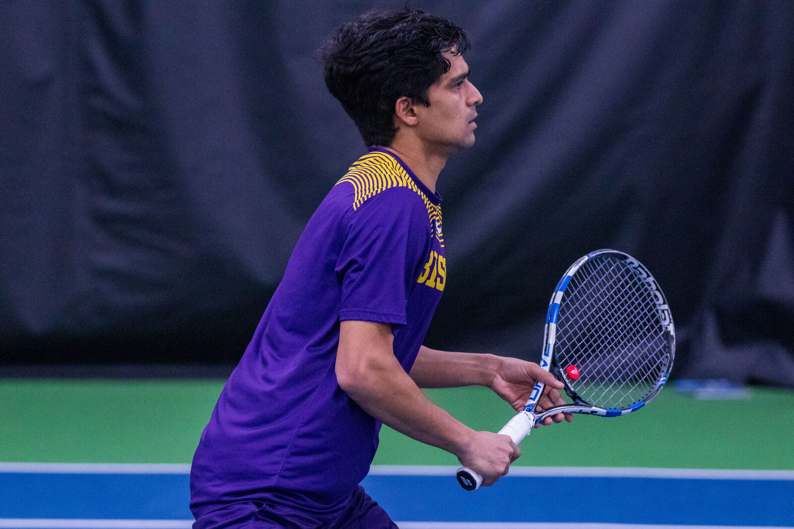 Vikash Singh hitting a forehand outdoors